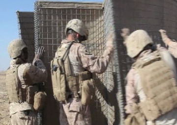 Garmser - Marines with 1st Combat Engineer Battalion set up Hesco Barriers for a New Patrol Base