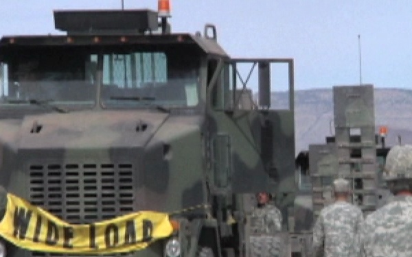 Truck drivers move tanks