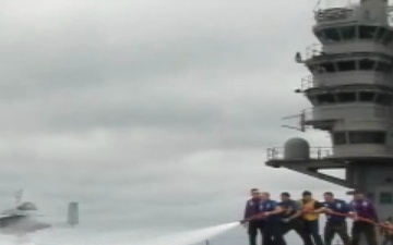 Sailors Perform a Flight Deck Scrub Down