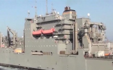 USS Stout Replenishes at Sea with the USS Lewis and Clark as Part of Odyssey Dawn