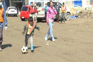 Playing Soccer with Displaced Citizens