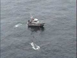 Coast Guard Rescues Three From Capsized Vessel