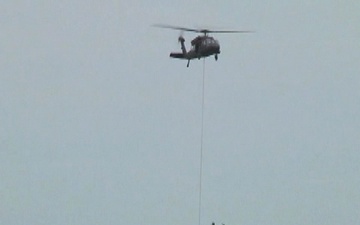 Missouri Guard Blackhawk Drops Sand Bags on Levee