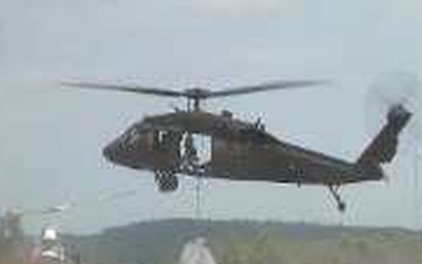 Guardsmen airdrop sandbags to reinforce levee