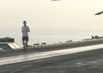 USS George H. W. Bush Sailors Running on the Flight Deck