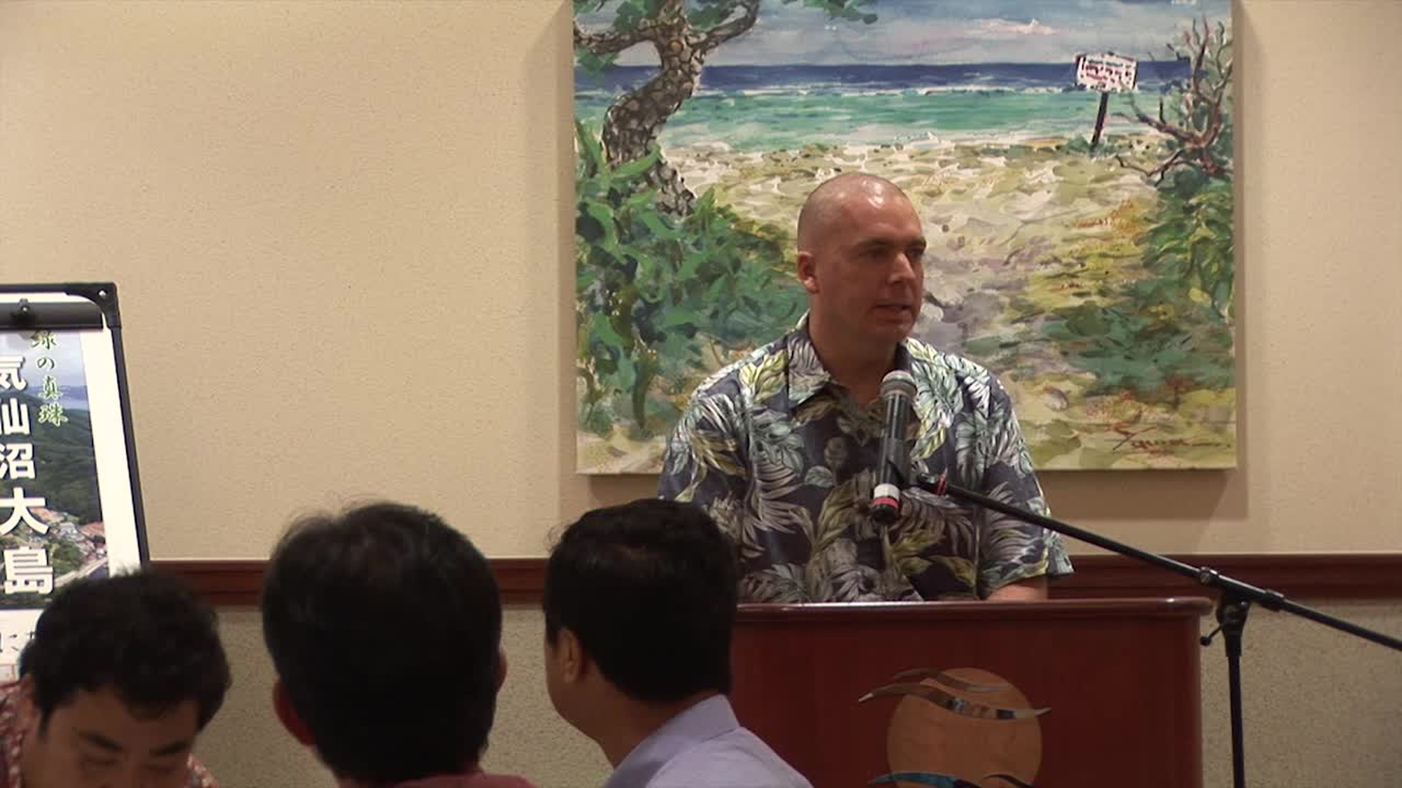 Japanese guests and host families attend a disaster relief brief hosted by Col. Elliot and Dr. Eldridge at the Ocean Breeze aboard Camp Foster, Okinawa, Japan as part of a four day cultural exchange and community relations event in response to the March 11, 2011 tsunami, earthquake and nuclear incident that devastated the Tohoku Region of Japan and displaced thousands of families.  Marine Corps Base Camp Smedley D. Butler coordinated and supported a four day cultural exchange and community relations event for school aged children of the region from 6 to 9 August 2011 on Okinawa in order to enhance the existing spirit of mutual trust and partnership between the United States and Japan.
