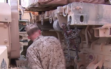 Master Sergeant Fernandez Inspecting Trucks