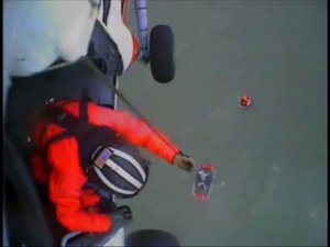 Coast Guard Airlifts Three from Aground Sailboat