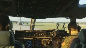 Army Personnel Load Onto/Jump Out of C-17