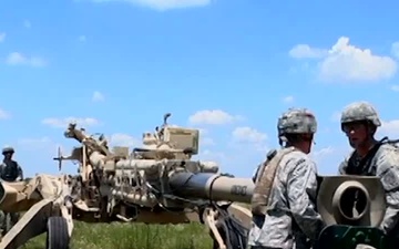 Paratroopers Unload, Fire Howitzer