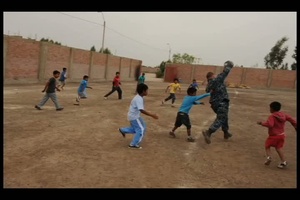 USS Underwood Sailors Playing with Local Children