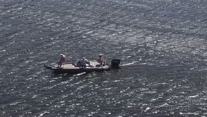 Lake Okeechobee and Herbert Hoover Dike in Fla., U.S.A. featuring recreational bass fishing boat 004
