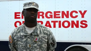 La National Guard assits help process truck for distribution to local areas