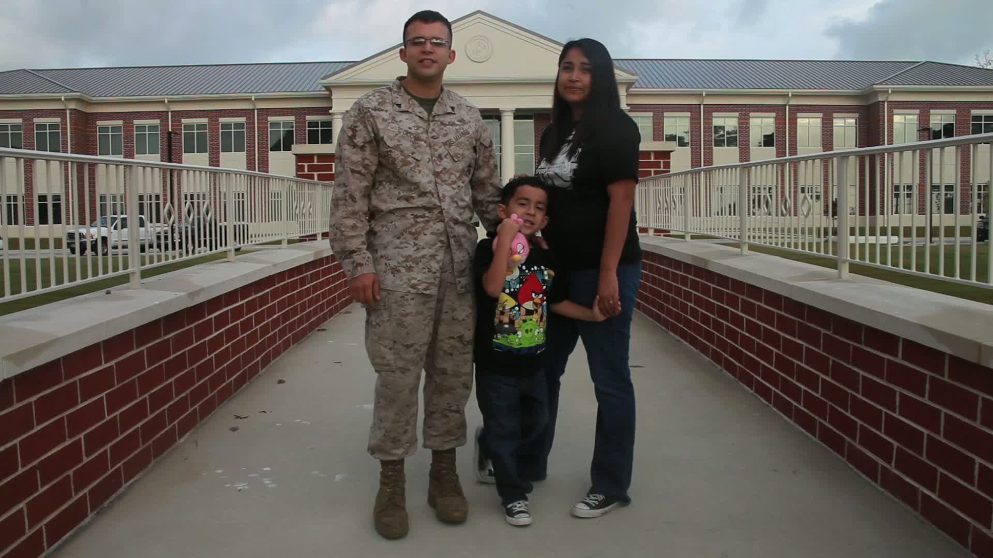 The Colon Family, Cpl. Santiago G. Colon Jr. (left), Roman (center), and Tiffany (right), send a shout out to family and friends in San Antonio and to the San Antonio Spurs. Also available in high definition.