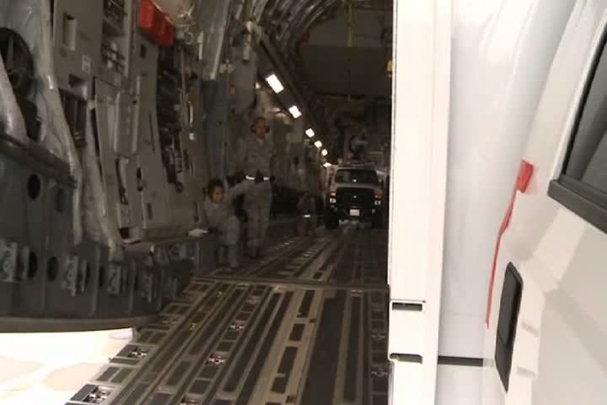 Southern California Edison trucks are loaded onto a U.S. Airforce C-17 Globemaster III  in support of Hurricane Sandy relief efforts at March Air Reserve Base, Calif., Nov. 1, 2012. Military bases across the nation are mobilizing to the northeast region of the country to restore electricity and provide humanitarian assistance, as currently more than two million people are without power. Interview with Raymond F. Hicks(U.S. Air Force photo by TSgt Mary Johanson)