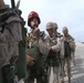 Marines, Supplies Parachute Out of Airplane