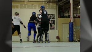 Airman Flies Around Roller Derby Rink