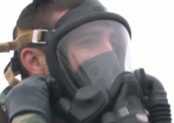 Airmen Operate Fire Truck in Gas Masks