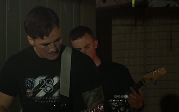 SPC Rory Garcia Plays Original Songs For Troops