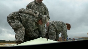 Global Medic 2013 U.S. Army Soldiers and U.S. Air Force Airmen assembling Alaska Structures Aeromedical Evacuation Tents