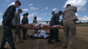 Global Medic 2013/WAREX 86-13-01 U.S. Soldiers, Sailors and Airmen Transport Casualty Mannequins on to a U.S. Air Force C-130