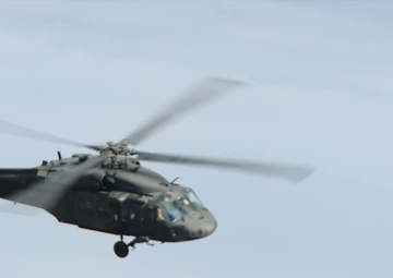 UH-60L Blackhawk Helicopters Fly Through Canyons