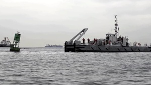 Coast Guard, Navy retrieve aground buoy from Chic's Beach, Va.