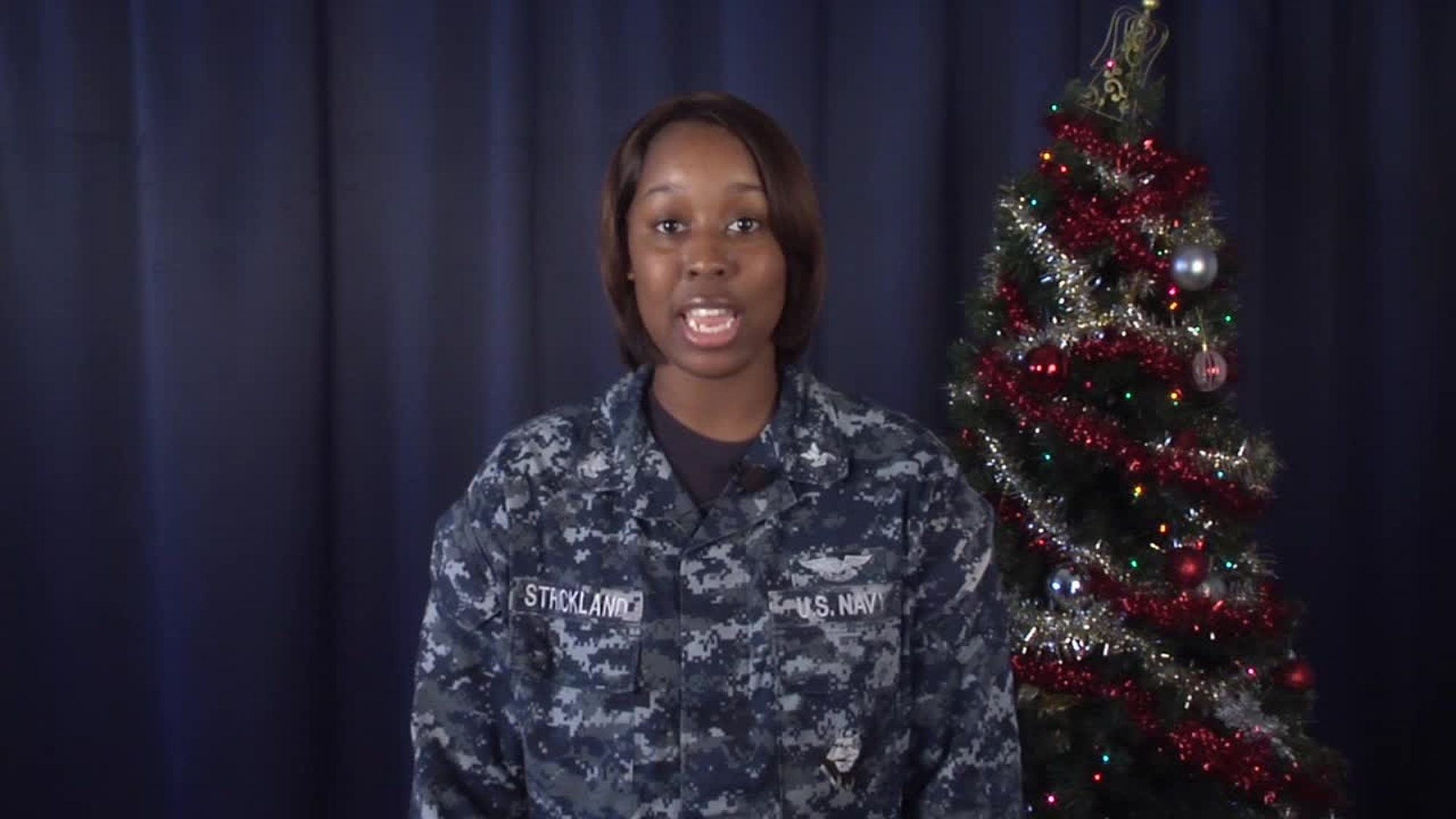 Petty Officer 2nd Class Jalisha Strickland sends a greeting to Denver, Colorado from USS Mount Whitney (Gaeta, Italy) for Holiday Season 2013.