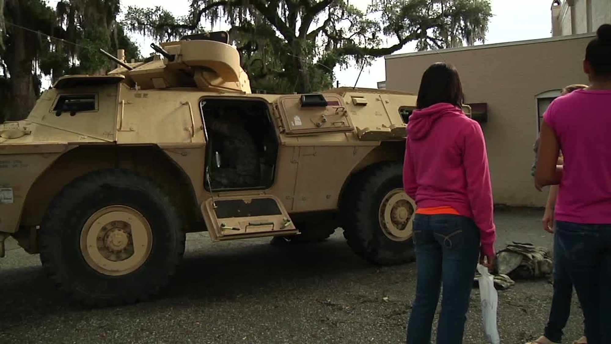 Two battalions from the 2nd Armored Brigade Combat Team, 3rd Infantry Division have static displays set up at the Darien Fall Festival and Classic Car Show in Darien, Georgia on November 2, 2013. Soldiers from 2-3 Brigade Troops Battalion showcase an Armored Security Vehicle (ASV) while Troopers from 307 Cavalry present two HMMWVs (Humvees). Available in high definition.