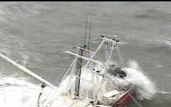Big Wave Crashes Over a Shrimp Boat