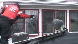 U.S. Coast Guard and federal and local agencies conduct safety checks on flood victims
