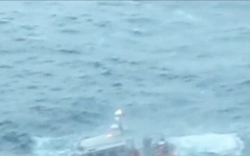 101026-G-0000-002 Coast Guard rescues three fishermen after boat fire