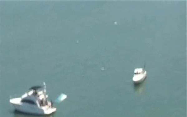 Two men resuced from overturned boat