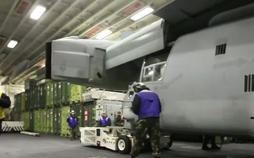 Sailors, Marines move aircraft aboard USS Bataan