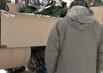 Michigan National Guard conducts cold weather sling load and howitzer live fire exercise
