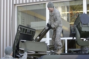 A Troop, 1st-297th Reconnaissance and Surveillance Squadron, Alaska Army National Guard , Anchorage, Alaska, assists in setting up a shelter in Cordova, Alaska.