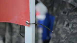 A Troop 1-297th Reconnaissance and Surveillance Squadron assists in distributing water