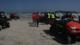 Task force crews undergo decontamination during debris removal