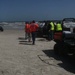 Task force crews undergo decontamination during debris removal