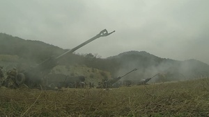 Artillery gun line firing for effect at SSang Yong 2014