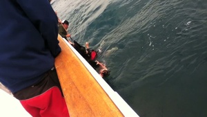 Three rescued from capsized boat