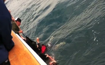 Three rescued from capsized boat