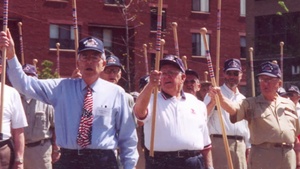 World war II veteran and National Guard unit exchange tokens of gratitude