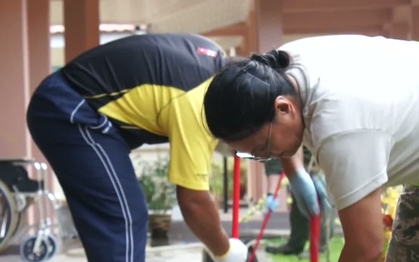 Airmen from the Pacific Air Force and National Guardsmen from Hawaii and Massachusetts perform community service for Cope Taufan 2014.