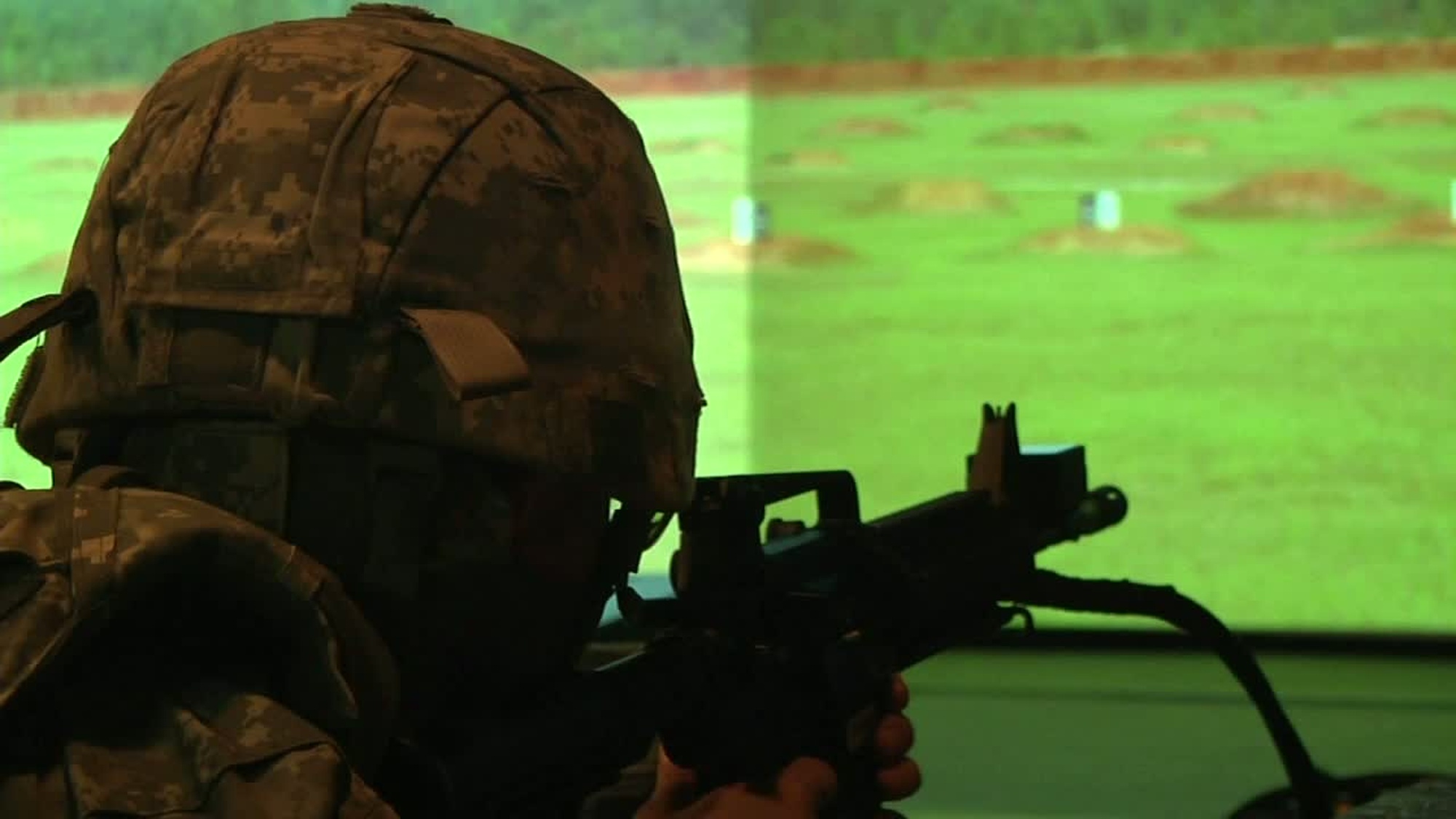 Soldiers competing in the Army Reserve Best Warrior Competition fire for qualification on the EST2000. This was one of many events during the competition and tested the soldiers&#39; ability to fire an M4 rifle. Available in high definition.
