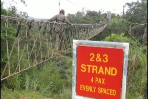 Marines learn how to navigate rough terrain in Okinawa jungle