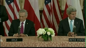 Secretary of State John Kerry signs a Memorandum of Understanding