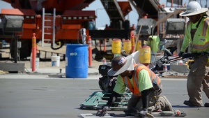 Workers top-off the mass concrete for the Folsom auxiliary