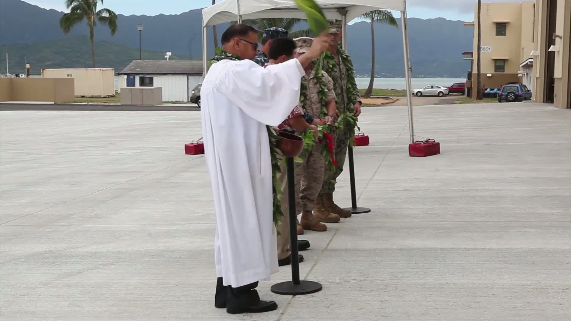 U.S. Marines, Sailors and Contractors aboard Marine Corps Base (MCB) participate in the ribbon cutting ceremony for Waterfront Operations Maintenance building.  The new facility enhances Waterfront Operations by being capable of an immediate response to contain and recover spilled oil, as well as protective sensitive areas within the bay, providing MCB Hawaii with waterborne Search and Rescue assets, and lastly giving assistance to Military Police by enforcing security.<br />regulations in prohibited and restricted waters.