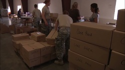 Soldiers help citizens with distribution center